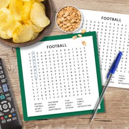 Football Word Search printable on a table with pen and snacks for Super Bowl Sunday