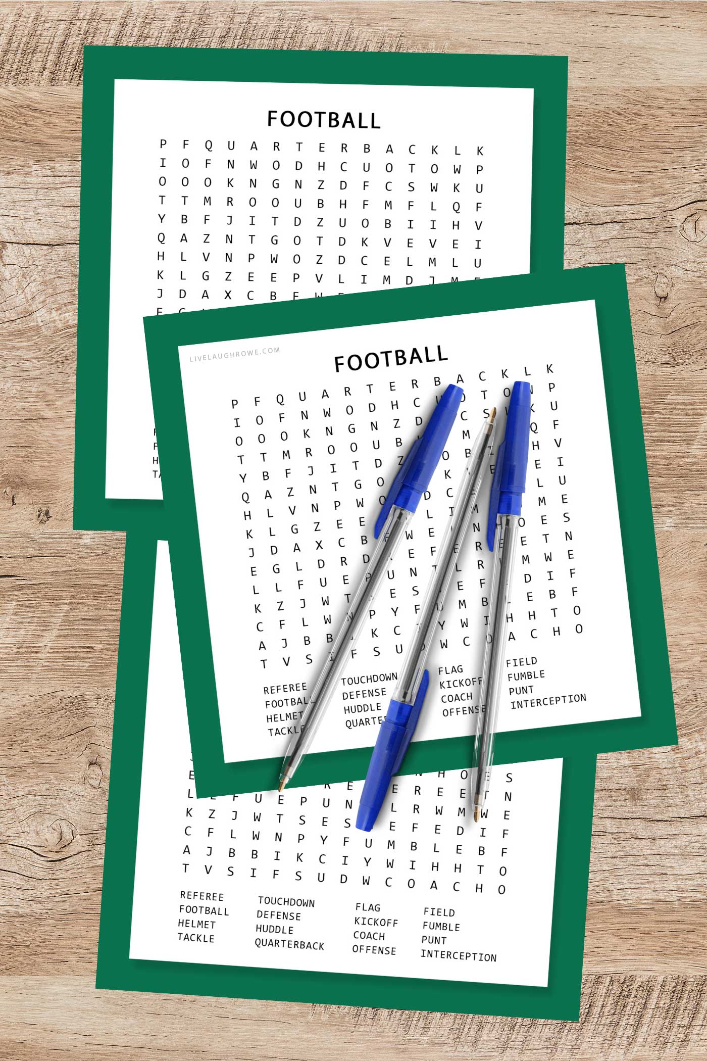 Stack of Football Word Search printables with pens for a Super Bowl party activity