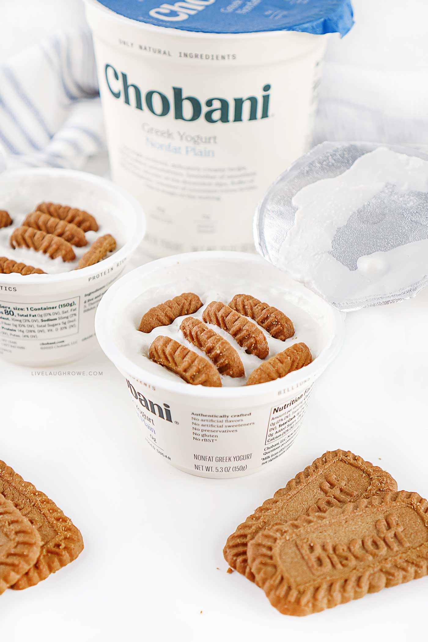 Greek yogurt cup with Biscoff cookies inserted to create a viral Japanese cheesecake hack before refrigerating.