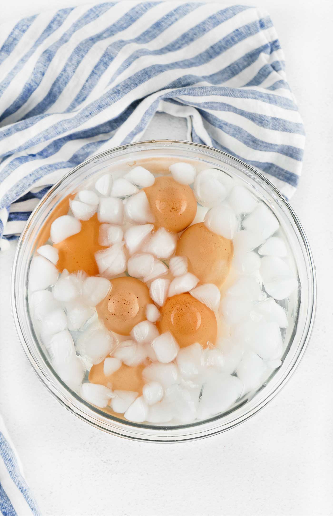 Hard boiled eggs cooling in an ice bath to stop the cooking process