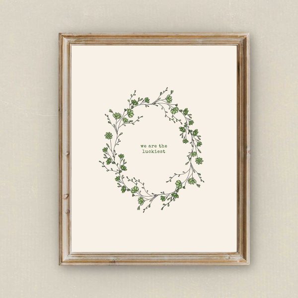Framed botanical quote printable displayed on a neutral wall