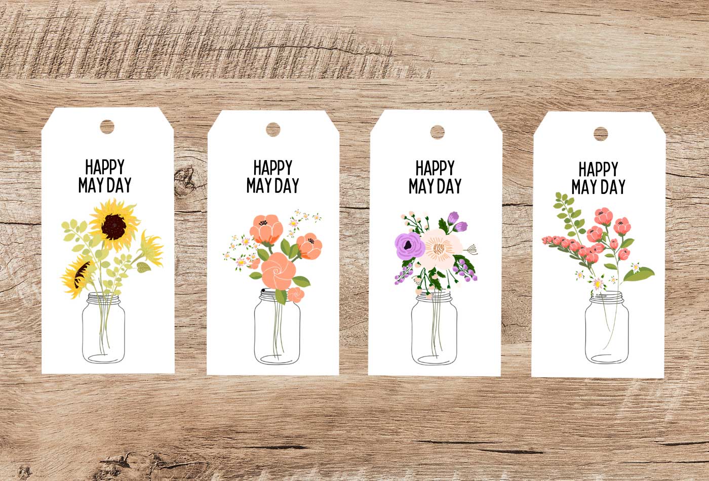 Printable tags with floral mason jar designs displayed on a wood background