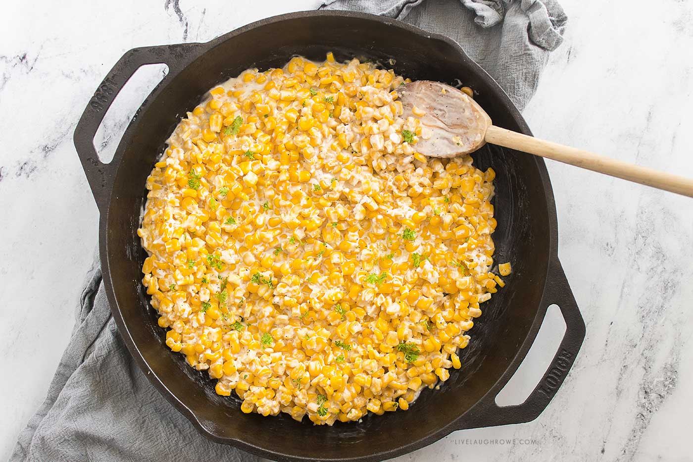 Finished honey butter skillet corn served in a cast iron skillet with creamy texture and golden corn