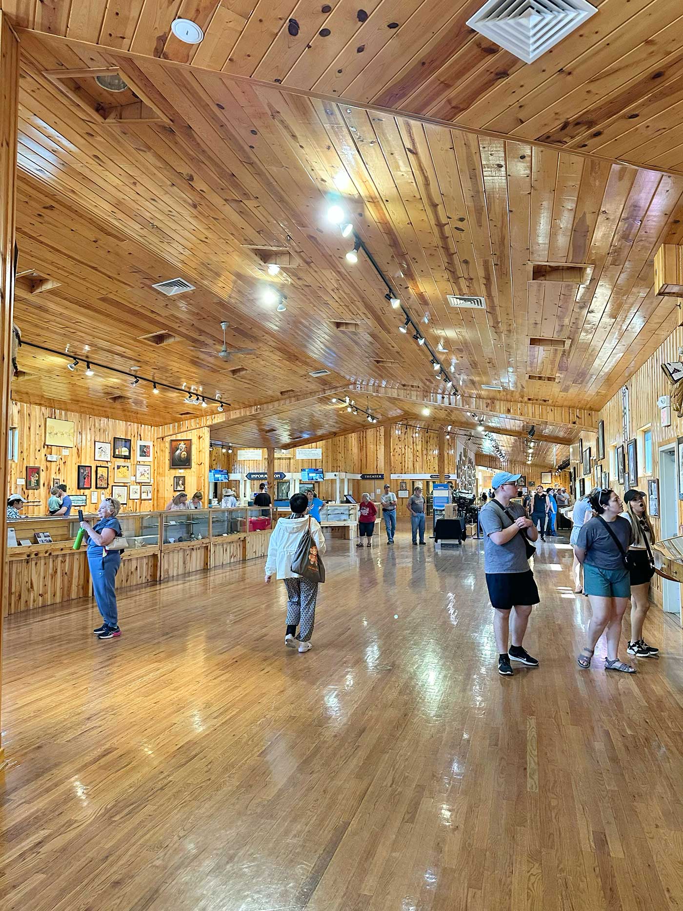 Visitors exploring the spacious interior exhibits at Crazy Horse Memorial.