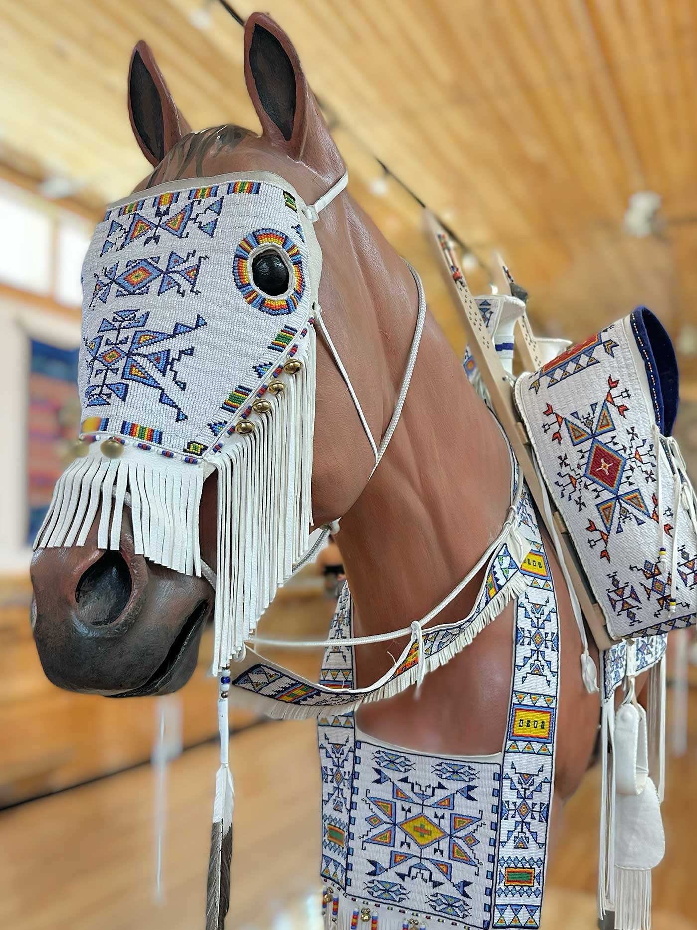 Decorative horse sculpture displayed inside the Crazy Horse Memorial visitor center.