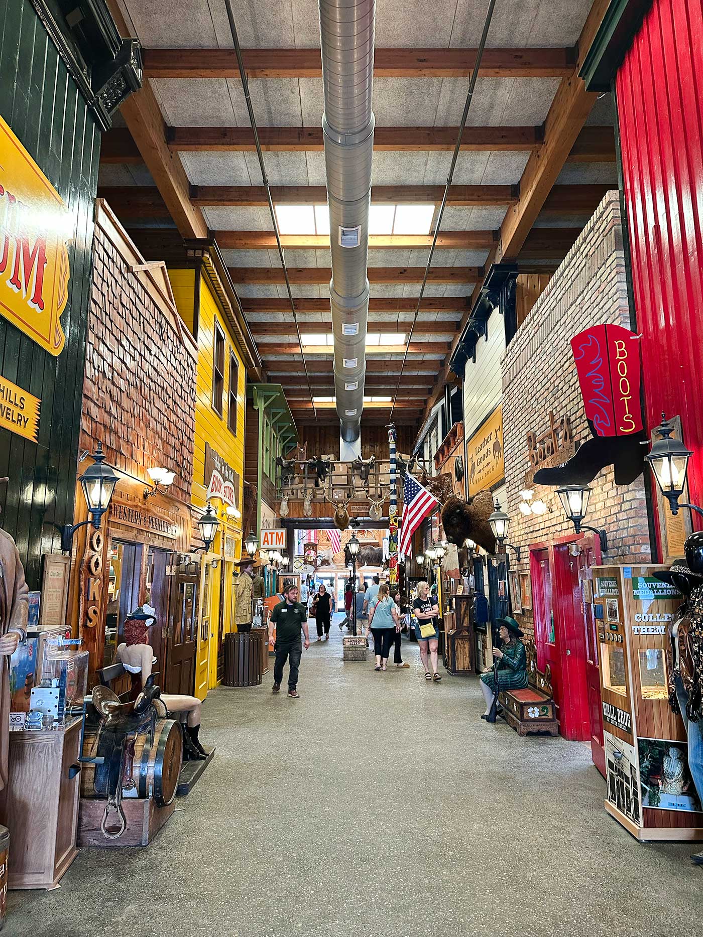 Visitors walking through the souvenir shops and attractions inside Wall Drug.