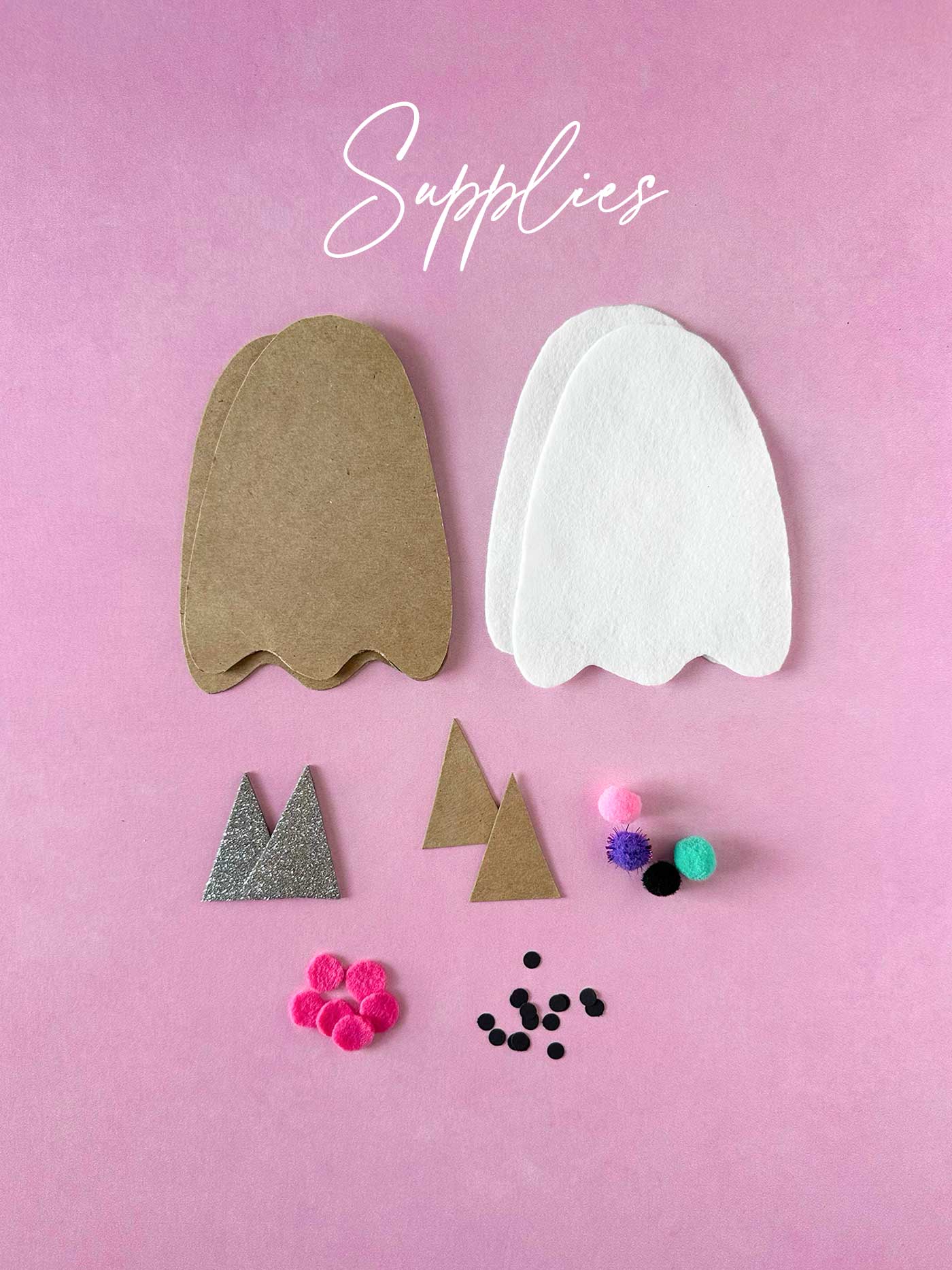 White felt and cardboard ghost shapes with glitter hat pieces, pom-poms, and small embellishments