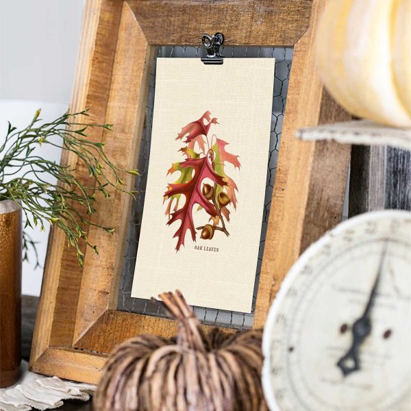 Vintage oak leaves and acorns fall printable clipped inside a rustic wood frame with a decorative pumpkin and antique kitchen scale